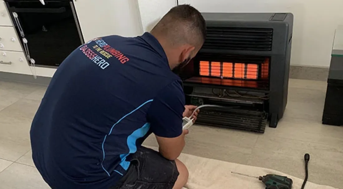 Hero Plumbing Expert inspecting a gas heater in Sydney Home