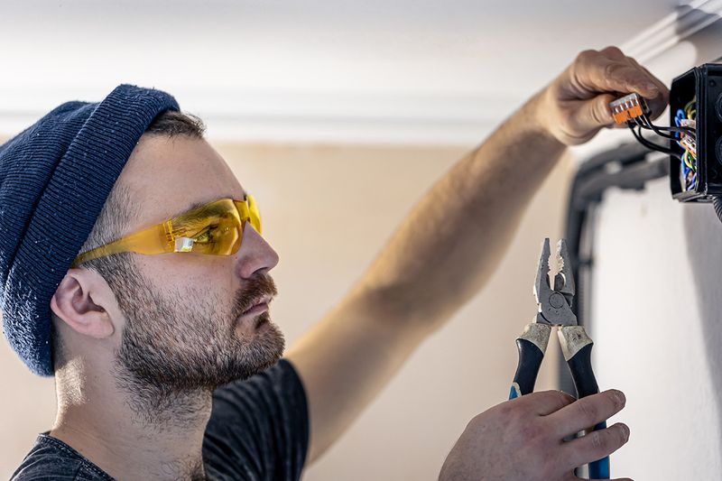 Hero Electrical electrician rewiring a power outlet in Sydney